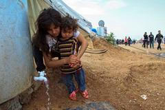 Saddámovu základnu si uprchlí Syřané přestavěli v Iráku na město. Reportáž Aktuálně.cz