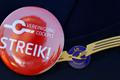 Lufthansa pilot wears badge reading "strike" on his uniform as he takes part in a demonstration at Fraport airport in Frankfurt
