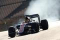 Tyres smoke as Manor Racing Formula One driver Haryanto of Indonesia takes a curve with his car during the third testing session ahead of the upcoming season at the Circuit Barcelona-Catalunya in Mont