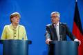 Merkelová a Juncker