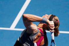 Lucie Safarova of the Czech Republic serves to Li Na of China during their women's singles match at the Australian Open 2014 tennis tournament in Melbourne