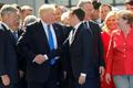 Trump Macron summit NATO handshake podání ruky
