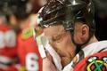 Blackhawks Marian Hossa cools off at the bench during overti