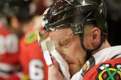 Blackhawks Marian Hossa cools off at the bench during overti