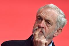 Britain's opposition Labour party leader Jeremy Corbyn listens to speakers at the annual Labour Party Conference in Brighton