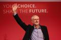 The new leader of Britain's opposition Labour Party Jeremy Corbyn waves after making his inaugural speech at the Queen Elizabeth Centre in central London