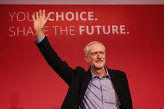 The new leader of Britain's opposition Labour Party Jeremy Corbyn waves after making his inaugural speech at the Queen Elizabeth Centre in central London