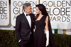George and Amal Clooney arrive at the 72nd Golden Globe Awards in Beverly Hills