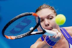 Halep of Romania hits a return to Makarova of Russia during their women's singles quarter-final match at the Australian Open 2015 tennis tournament in Melbourne