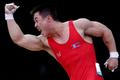 Severokorejský vzpěrač Guk Kim Un se raduje ze světového rekordu mužů do 62 kg na OH 2012 v Londýně.