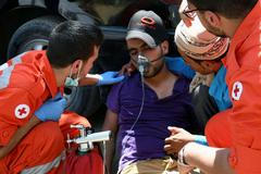 Syrský uprchlík při požáru tábora v Libanonu