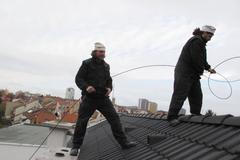 Kominíci při práci