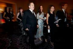 Weinstein Company chaiman Harvey Weinstein arrives with wife and fashion designer Georgina Chapman at the 72nd Golden Globe Awards in Beverly Hills