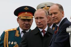 Russian President Putin, Defence Minister Shoigu and FSB Director Bortnikov watch events to mark Victory Day in Sevastopol