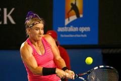 Bethanie Mattek-Sands of the United States hits a return to  Maria Sharapova of Russia during their women's singles match at the Australian Open 2014 tennis tournament in Melbourne