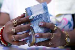 Peníze, bankovky, bohatství - ilustrační foto