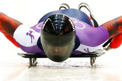 Russia's Alexander Tretiakov speeds down the track during a men's skeleton training at the Sanki sliding center in Rosa Khutor