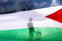 Protesty kvůli otevření americké ambasády v Jeruzalémě. Palestinská vlajka.