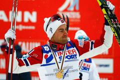 Norway's Northug celebrates winning the men's cross country 50 km mass start classic race at the Nordic World Ski Championships in Falun