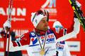 Norway's Northug celebrates winning the men's cross country 50 km mass start classic race at the Nordic World Ski Championships in Falun