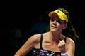 Radwanska of Poland celebrates her win over Kvitova of the Czech Republic during their WTA Finals singles tennis match at the Singapore Indoor Stadium