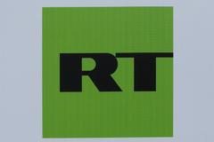 FILE PHOTO: The logo of Russian television network RT is seen on a board at the SPIEF 2017 in St. Petersburg