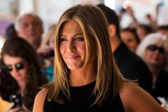 Aniston arrives for the "Cake" gala at the Toronto International Film Festival in Toronto