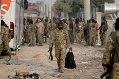 Syrští povstalci ze Syrské národní armády (FSA) v Turecku