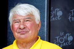 FILE PHOTO: Former French cyclist Raymond Poulidor is seen on the podium of the 168.5 km ninth stage of the centenary Tour de France cycling race from Saint-Girons to Bagneres-de-Bigorre