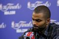 San Antonio Spurs' Tony Parker reacts as he speaks to the me