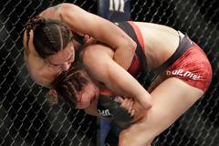 Lucie Pudilová v zápase UFC proti Antonině Ševčenkové (2019)