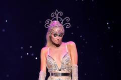 Paris Hilton presents a creation from The Blonds Spring 2020 collection during a collaboration performance with Moulin Rouge! The Musical during New York Fashion Week in New York City