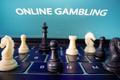 Chess are placed on the keyboard in front of displayed "Online Gambling" words in this illustration picture