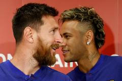 FILE PHOTO: FC Barcelona players Lionel Messi and Neymar attend a news conference to announce the sponsorship deal between the team and Rakuten Inc. in Tokyo