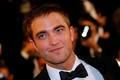 Cast member Robert Pattinson poses on the red carpet as he arrives for the film "The Rover" out of competition at the 67th Cannes Film Festival in Cannes
