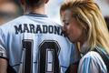 People gather to mourn the death of soccer legend Diego Maradona, outside the Diego Armando Maradona stadium, in Buenos Aires