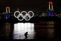 The giant Olympic rings are illuminated after being reinstalled at Odaiba Marine Park, amid the coronavirus disease (COVID 19) outbreak, in Tokyo