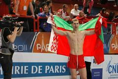FILE PHOTO: Belarus's Krauchanka and Czech Republic's Sebrle react after the men's Heptathlon event at the European Athletics indoor championships in Paris