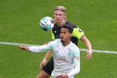 Erling Haaland a Theo GebreSelassie