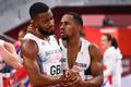 Nethaneel Mitchell-Blake of Britain is consoled by Chijindu Ujah of Britain after winning silver