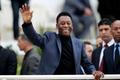 FILE PHOTO: Brazilian soccer legend Pele waves during the international friendly soccer match between Algeria and Slovenia in Algiers