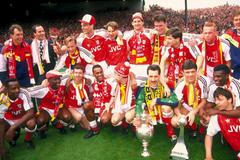FILE PHOTO: Arsenal manager George Graham celebrates with his players after they clinched their second League Championship in three years, finishing above holders Liverpool.