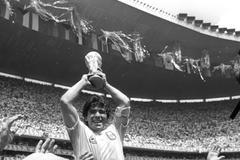FILE PHOTO: ARGENTINA'S MARADONA LIFTS THE WORLD CUP AFTER MATCH AGAINST WEST GERMANY IN MEXICO.