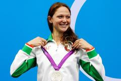 FILE PHOTO: Belarus' Aliaksandra Herasimenia smiles with her silver medal during the women's 100m freestyle victory ceremony during the London 2012 Olympic Games at the Aquatics Centre