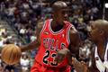 FILE PHOTO: Chicago Bulls guard Michael Jordan of the defending NBA champion Chicago Bulls drives to the hoop ag..