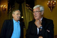 FILE PHOTO: Italy's coach Lippi chats with Riva before news conference in Rome