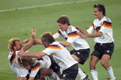 FILE PHOTO: West Germany's Brehme is mobbed by teammates after he scored the only goal of the World Cup final against Argentina on a penalty kick