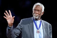 FILE PHOTO: Celtics' legend Russell stands with his Presidential Medal of Freedom during the NBA All-Star basketball game in Los Angeles