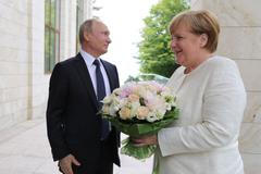 Angela Merkelová při setkání s Vladimirem Putinem v Soči