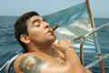 FILE PHOTO: Argentine soccer star Diego Maradona smokes a Cohiba as he rides a sailboat
